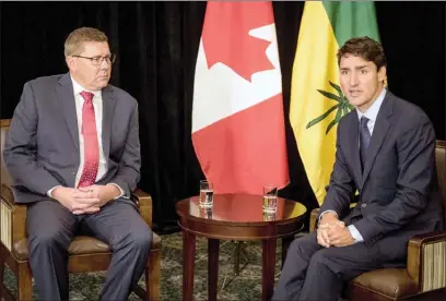  ?? The Canadian Press ?? Prime Minister Justin Trudeau, right, meets with Saskatchew­an Premier Scott Moe in Saskatoon on Wednesday.