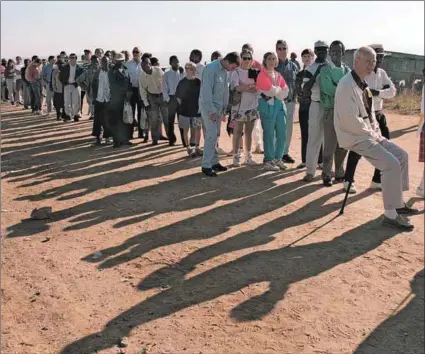  ?? Photo:kevin Carter/afp ?? New beginnings: South Africa queue to vote in the country’s first multi-racial elections (above). But the author argues that the concensus reached 30 years ago has eroded.