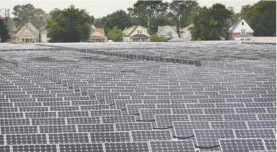  ?? SCOTT OLSON / GETTY IMAGES FILES ?? In the U.S., solar stocks have been huge winners, with companies such as Solaredge (SEDG on Nasdaq) up 242 per
cent in the past year, and up nine per cent in the first three days of 2001, Peter Hodson notes.