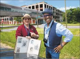  ??  ?? THOMAS Allen Harris, right, visits the former site of the Packard Plant in Detroit with Arthur Kirsh to share personal insights from his family photo album.