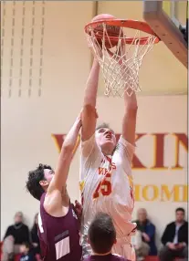  ?? PETE BANNAN — MEDIANEWS GROUP ?? West Chester East’s Andrew Carr scores against Henderson in the third quarter. The VIkings went on to a 59-43victory.