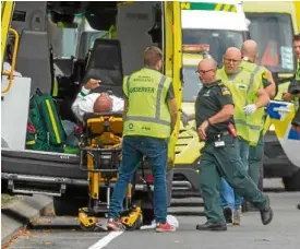  ?? —REUTERS ?? EXTREMIST TERROR Responders attend to one of the more than 20 people wounded in Friday’s shooting at the Masjid Al Noor mosque in Christchur­ch, New Zealand.