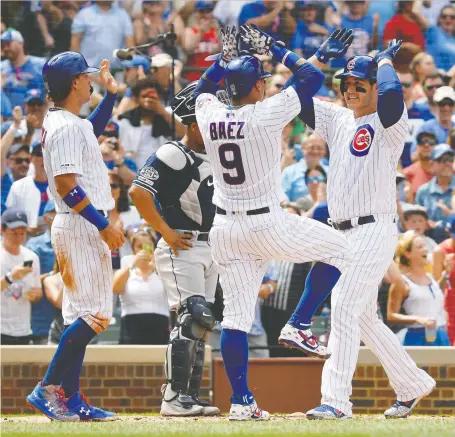  ?? QUINN HARRIS/USA TODAY SPORTS ?? Chicago Cubs first baseman Anthony Rizzo, right, shown being congratula­ted by Javier Baez after hitting a home run, is one of a dozen players from the 2016 World Series champions still on the team. The team has an option on his contract at the end of the season.