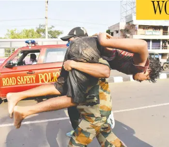  ?? THE ASSOCIATED PRESS ?? A boy affected by a gas leak is carried for medical treatment in Visakhapat­nam, India. The gas leaked from a chemical plant early Thursday, leaving people struggling to breathe and collapsing in the streets as they tried to flee the area.