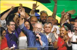  ?? Andre Penner Associated Press ?? FORMER Brazilian President Luiz Inácio Lula da Silva addresses supporters Sunday in Sao Paulo after defeating far-right incumbent Jair Bolsonaro.