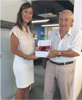  ??  ?? EmCare Operations & Sales manager and Customer Experience Lucienne Bezzina presenting the emCare mobile phone to Salvu Calleja