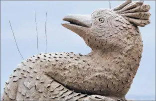  ?? CP FILE PHOTO ?? Wires poke from the detail of a bird to detract actual birds from landing on a sand sculpture titled “Seduction” by Michel Lepire, of Quebec, on Hampton Beach in Hampton, N.H., in June 2017.