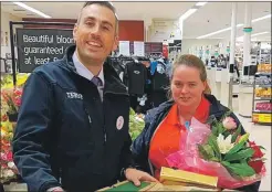  ??  ?? Oban Tesco store manager Brian Ross hands over the donated food to Jean MacPherson of Schools Out Oban.