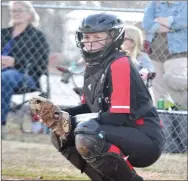  ?? ?? Lady Blackhawk sophomore Callie Cooper, No. 25, looks to the coach for the play while catching .