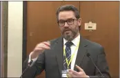  ?? COURT TV VIA AP ?? Defense attorney Eric Nelson questions Dr. Andrew Baker, Hennepin County Chief Medical Examiner, as Hennepin County Judge Peter Cahill presides Friday.