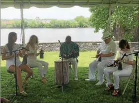  ?? NICHOLAS BUONANNO — NBUONANNO@TROYRECORD.COM ?? People perform some African music during the festival.