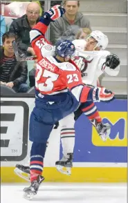  ?? Photo by Byron Hackett of Red Deer Advocate ?? Lethbridge Hurricanes forward Jadon Joseph lays a big hit on Red Deer Rebels forward Akash Bains Sunday night at the Enmax Centrium in Game 6 of the teams’ first round WHL playoff series. Lethbridge won 4-1 to force Game 7 in the series Tuesday night...