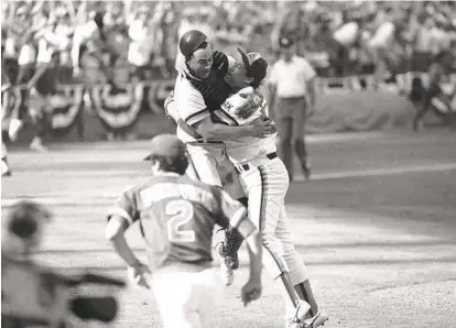  ?? 1984 AP FILE PHOTO ?? Padres catcher Terry Kennedy leaps into the arms of Goose Gossage after the Padres beat the Chicago Cubs 6-3 to win NLCS.