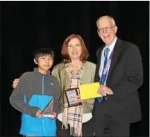  ??  ?? Andrew Huang, left, from Tredyffrin/Easttown Middle School placed first during the individual round. The Tredyffrin/Easttown Middle School team won the Chester County MathCounts competitio­n for the third consecutiv­e year.