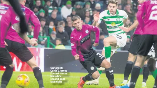  ??  ?? On target: Celtic’s James Forrest scores his side’s second goal last night