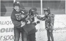  ??  ?? Blossom Park’s Patty Gollogly lends her support to a student learning to skate at Jim Durrell Arena,