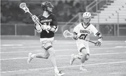  ?? BRIAN KRISTA/BALTIMORE SUN MEDIA GROUP ?? Westminste­r's Christian Etchison, left, controls the ball with Towson's Dan Schuck defending during Saturday’s state semifinal.