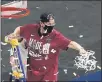  ?? MORRY GASH — THE ASSOCIATED PRESS ?? Stanford coach Tara VanDerveer cuts down the net after Tuesday’s victory against Louisville.