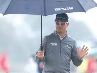  ?? AP ?? Zach Johnson, the 2015 Open champion, birdied the 18th hole for a 67 and moved into a tie for the lead.