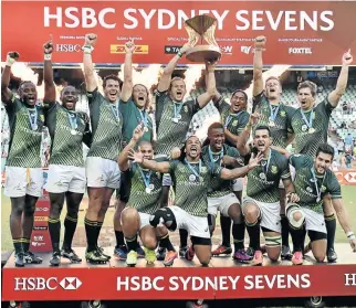  ?? PHOTO: PETER PARKS/AFP ?? Blitzboks celebrate their win over England as they clinched the Sydney leg of the Sevens World Series yesterday.