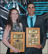  ?? NEWS PHOTO RYAN MCCRACKEN ?? Eagle Butte High School female and male athletes of the year Jasmine Salmon and Cole Mack stand with their awards during the school's athletic banquet on Wednesday.