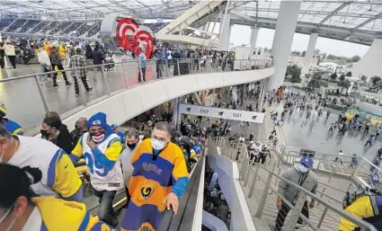  ?? Robert Gauthier Los Angeles Times ?? FANS WATCHING the Rams play in the Super Bowl at SoFi Stadium will need to wear a mask and provide proof of vaccinatio­n.