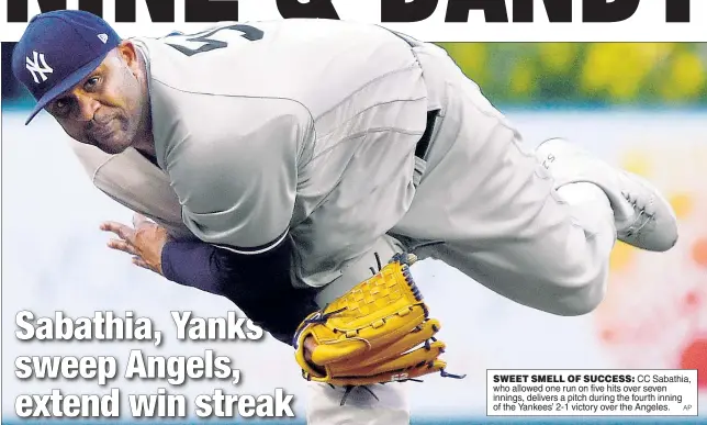  ?? AP ?? SWEET SMELL OF SUCCESS: CC Sabathia, who allowed one run on five hits over seven innings, delivers a pitch during the fourth inning of the Yankees’ 2-1 victory over the Angeles.