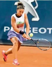  ??  ?? Sara Errani returns to Kristna Pliskova during their women’s singles quarterfin­al match at the Palermo Open tennis tournament on Thursday. Errai won 3-6, 6-4, 6-3.