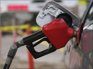  ?? DAVID ZALUBOWSKI — THE ASSOCIATED PRESS ?? In Los Angeles, prices for a gallon of self-serve regular gasoline fell 2.6cents to $5.599, its lowest amount since March 8.