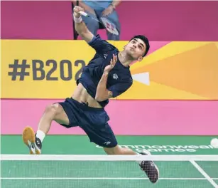  ?? PTI ?? Top class: Lakshya Sen clinched a thrilling 19-21, 9-21, 21-16 win against Malaysia’s Ng Tze Yong for his maiden gold. His stunning show meant, for the first time, India won both the women’s and men’s singles golds.