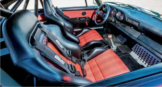  ??  ?? Below Few rally oriented 911s are as comfortabl­e as Matt’s SC, with red Pasha fabric covering plush sports seats