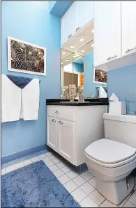  ?? TNS ?? Painting a bathroom a light shade of blue could bring a higher price at sale time.