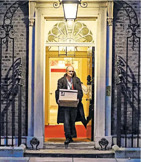  ??  ?? Dominic Cummings leaves No 10 with his possession­s in a cardboard box, after being ordered to clear his desk following accusation­s that he had briefed against the Prime Minister