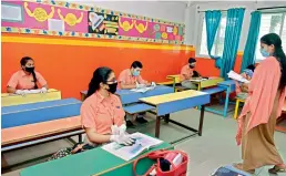  ?? —S.SURENDERRE­DDY ?? Students attend a class at St Peter’s High School in Secunderab­ad to clarify doubts on Monday. Some students turned up at private schools after they were reopened as part of Unlock 4.0.