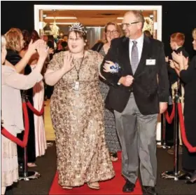  ??  ?? \Emily Smith and Jeff Reigner walk the Red Carpet as their names are announced.