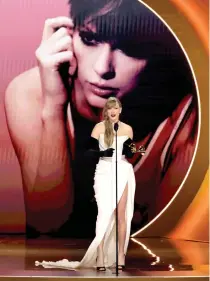  ?? IMAGES NORTH AMERICA / Getty Images via AFP Photo by KEVIN WINTER / GETTY ?? Taylor Swift accepts the Best Pop Vocal Album award for “Midnights” onstage during the 66th Grammy Awards on February 04, 2024 in Los Angeles, California.