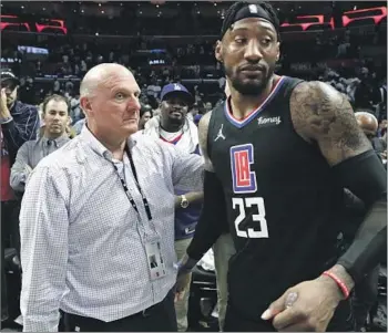  ?? Robert Gauthier Los Angeles Times ?? OWNER STEVE BALLMER, left, consoles Robert Covington after the Clippers’ play-in tournament loss to the Pelicans on Friday night, when L.A.’s elusive championsh­ip breakthrou­gh seemed very far away.