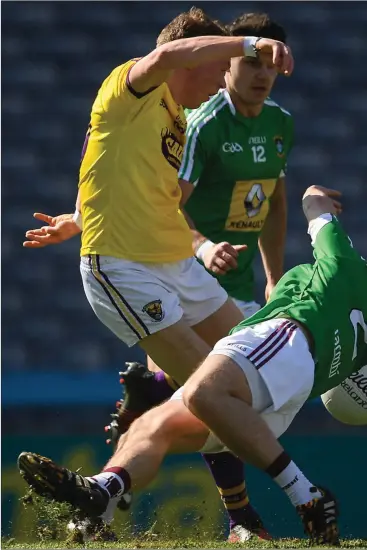  ??  ?? Kevin O’Grady shooting past Westmeath defender Mark McCallon to score Wexford’s first goal in Saturday’s