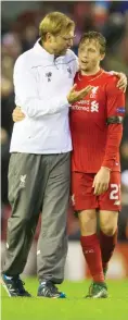  ??  ?? LIVERPOOL: Liverpool’s manager Juergen Klopp (left) walks from the pitch with Lucas Leiva after their team’s 2-1 in the Europa League Group B soccer match between Liverpool and Bordeaux at Anfield Stadium. — AP