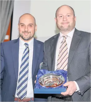  ??  ?? Bath Golf Club’s Russell Covey receives his award from the PGA’S Giuseppe Licata