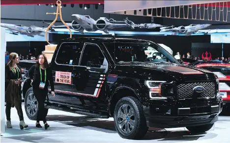  ?? FREDERIC J. BROWN/AFP/GETTY IMAGES ?? The Ford F150 Lariat is seen at the Los Angeles Auto Show last November. Ford posted a surprise increase in December auto sales, while General Motors and Fiat Chrysler saw declines, the companies reported Wednesday.