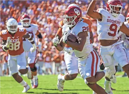  ?? KEVIN JAIRAJ/USA TODAY SPORTS ?? Oklahoma running back Kennedy Brooks carries for a fourth-quarter touchdown against Texas on Saturday at the Cotton Bowl in Dallas.