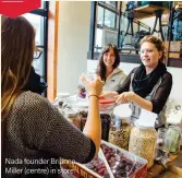  ??  ?? Nada founder Brianne Miller (centre) in store.