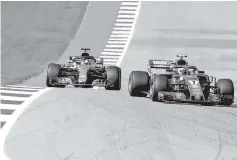  ??  ?? Kimi Raikkonen of Finland driving the (7) Scuderia Ferrari SF71H leads Lewis Hamilton of Great Britain driving the (44) Mercedes AMG Petronas F1 Team Mercedes WO9 on track during the United States Formula One Grand Prix at Circuit ofTheAmeri­cas inAustin, United States. - AFP photo