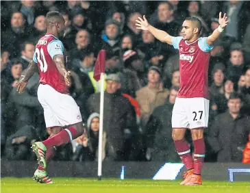  ??  ?? West Ham’s Michail Antonio, left, celebrates with Dimitri Payet after scoring against Tottenham.