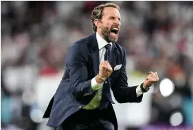  ??  ?? An ecstatic Gareth Southgate celebrates England’s victory against Denmark