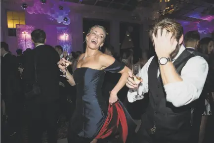  ?? Laura Morton / Special to The Chronicle ?? Heather Sager dances with Billy Carlile during the San Francisco Ballet Opening Night Gala after-party at City Hall.