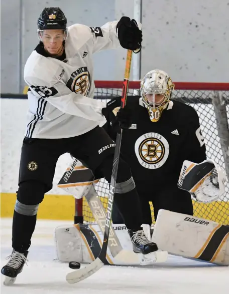  ?? CHRIS CHRISTO / HeRaLd STaFF FILe ?? BACK IN BLACK? Jack Studnicka deflects a shot in front of Dan Vladar during practice at Warrior Ice Arena on Sept. 13.