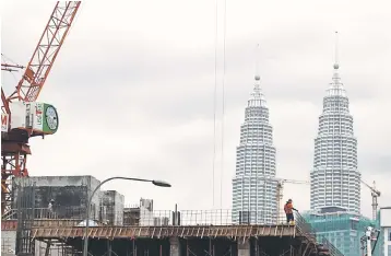  ??  ?? The government will not bail out property developers, particular­ly those building high-end projects, who failed to sell their units and faced financial difficulti­es, said Second Finance Minister Datuk Seri Johari Abdul Ghani. — Reuters photo