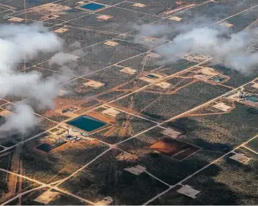  ?? Michael Ciaglo / Houston Chronicle ?? Oil rigs drill in the Permian Basin outside of Midland this year. Many oil companies are profitable again.